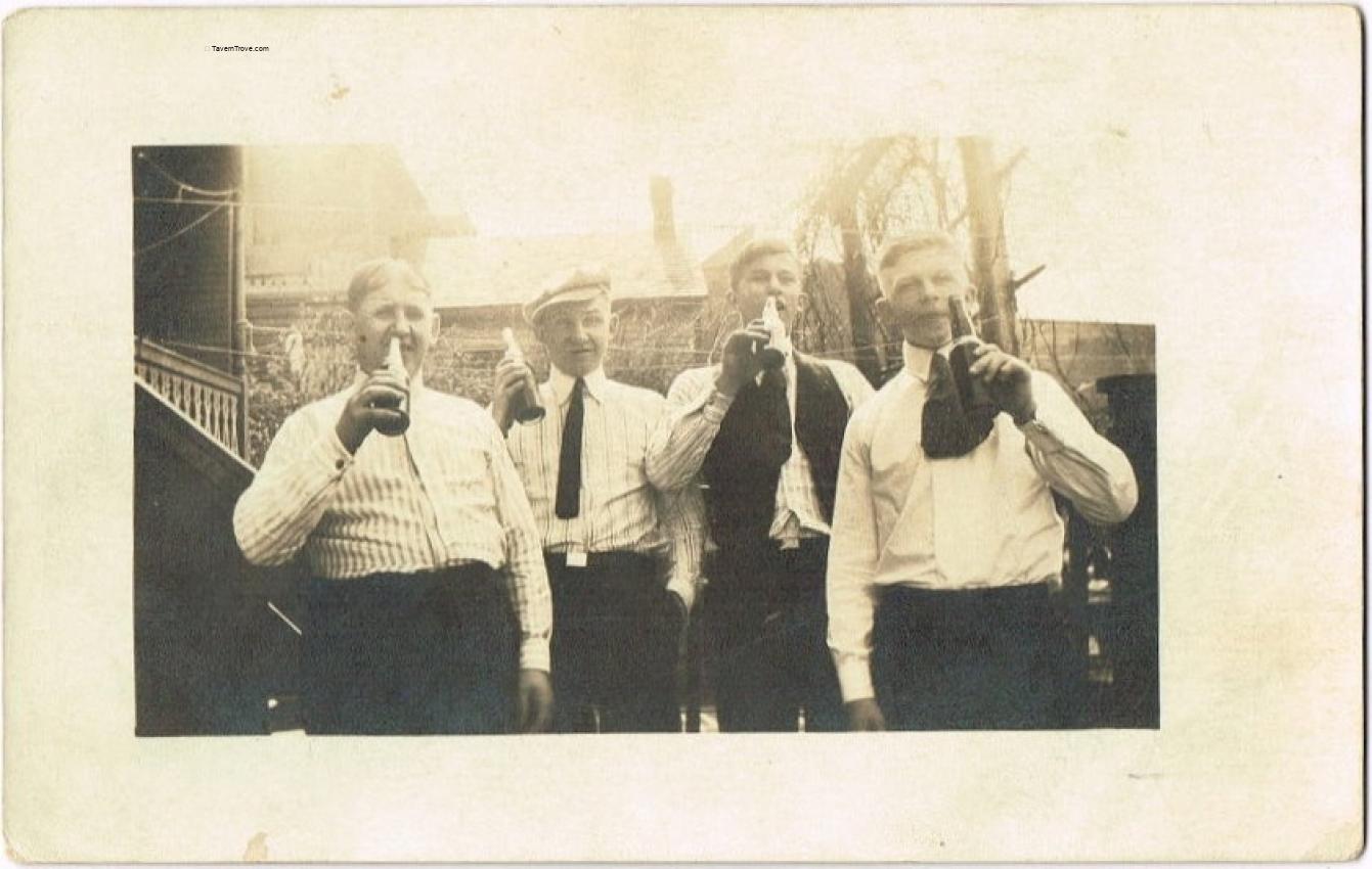 Four Guys Drinking Beer In Embossed Bottles RPPC