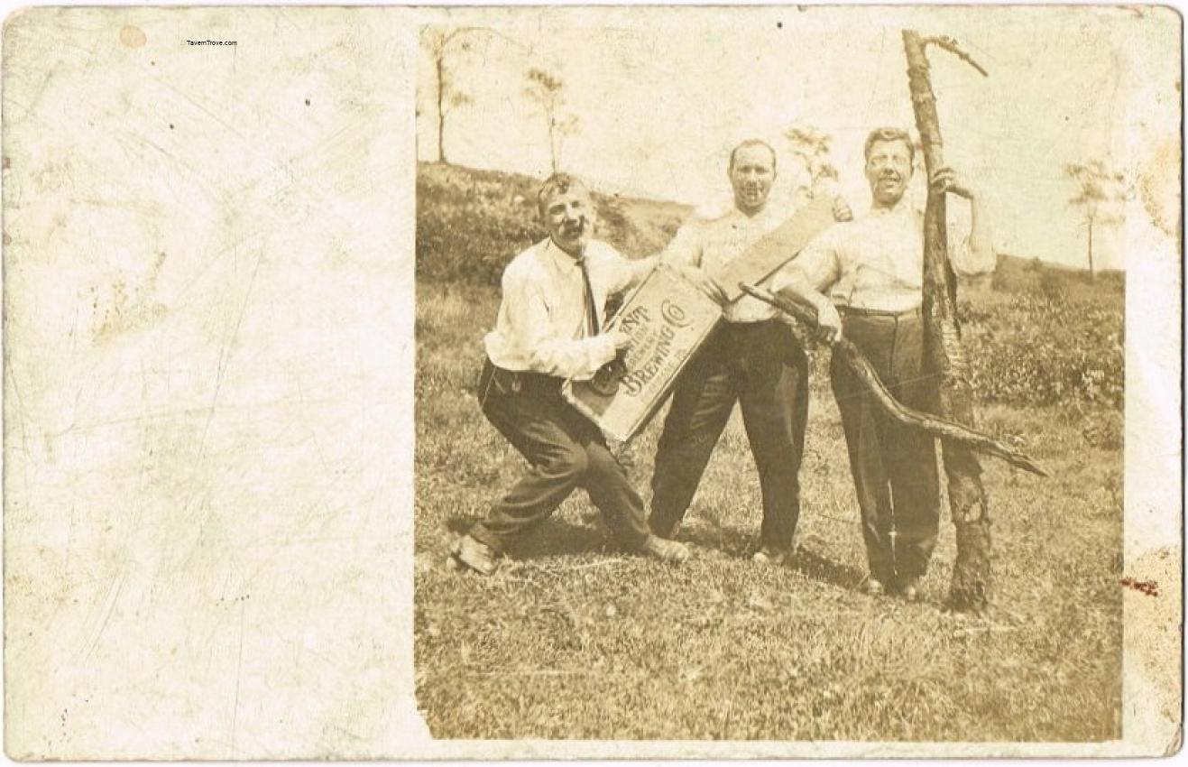 Three Guys Playing Around With A Crescent Brewery Crate