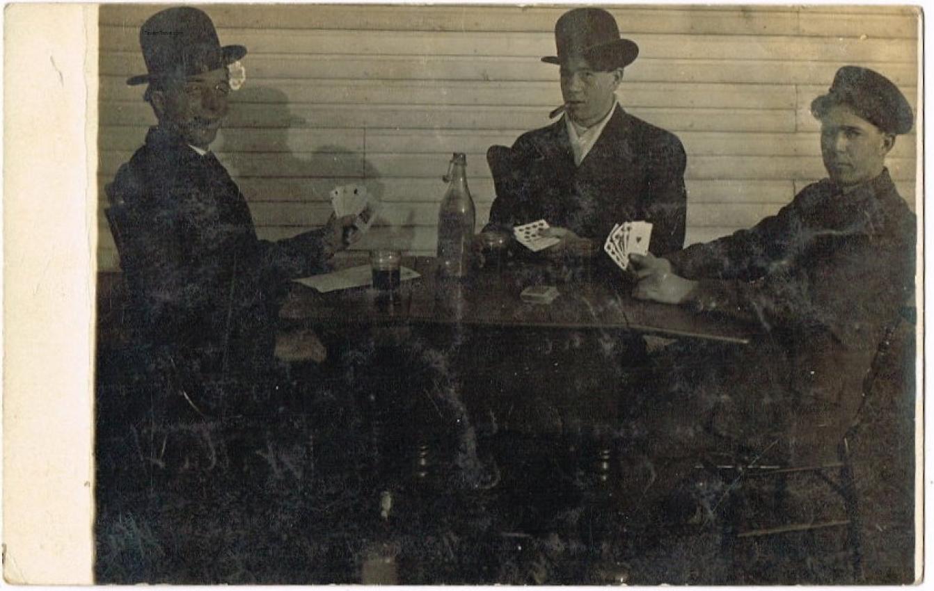 Three Men Play Poker And Drink Beer RPPC